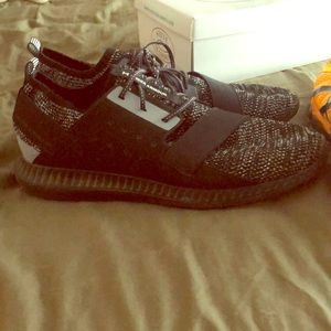 Black and gray knit under armour sneakers